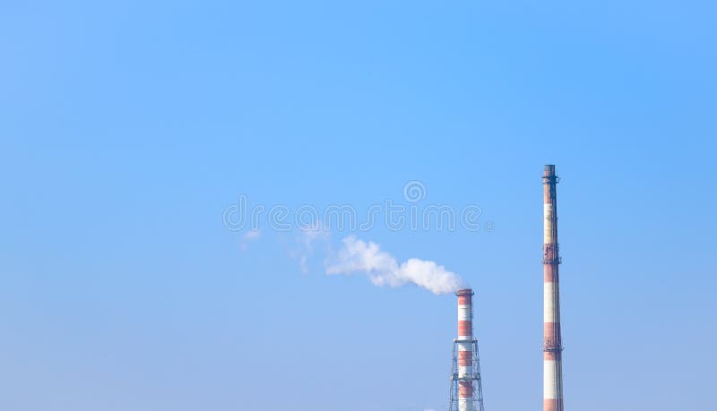 fig 4: Real-world photograph of smoke emissions from power plant chimneys illustrating environmental air pollution.